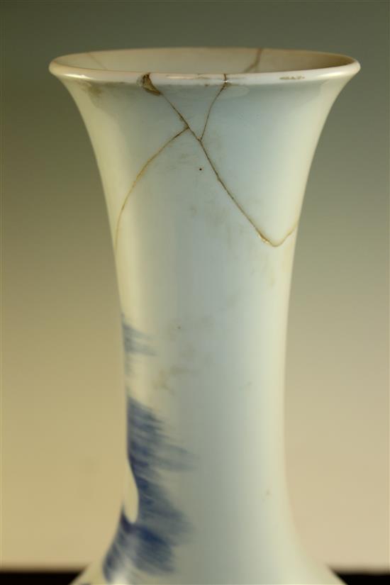 A Chinese underglaze blue and copper red crane and deer bottle vase, Kangxi six character mark, early 20th century, 39.5cm., neck rep